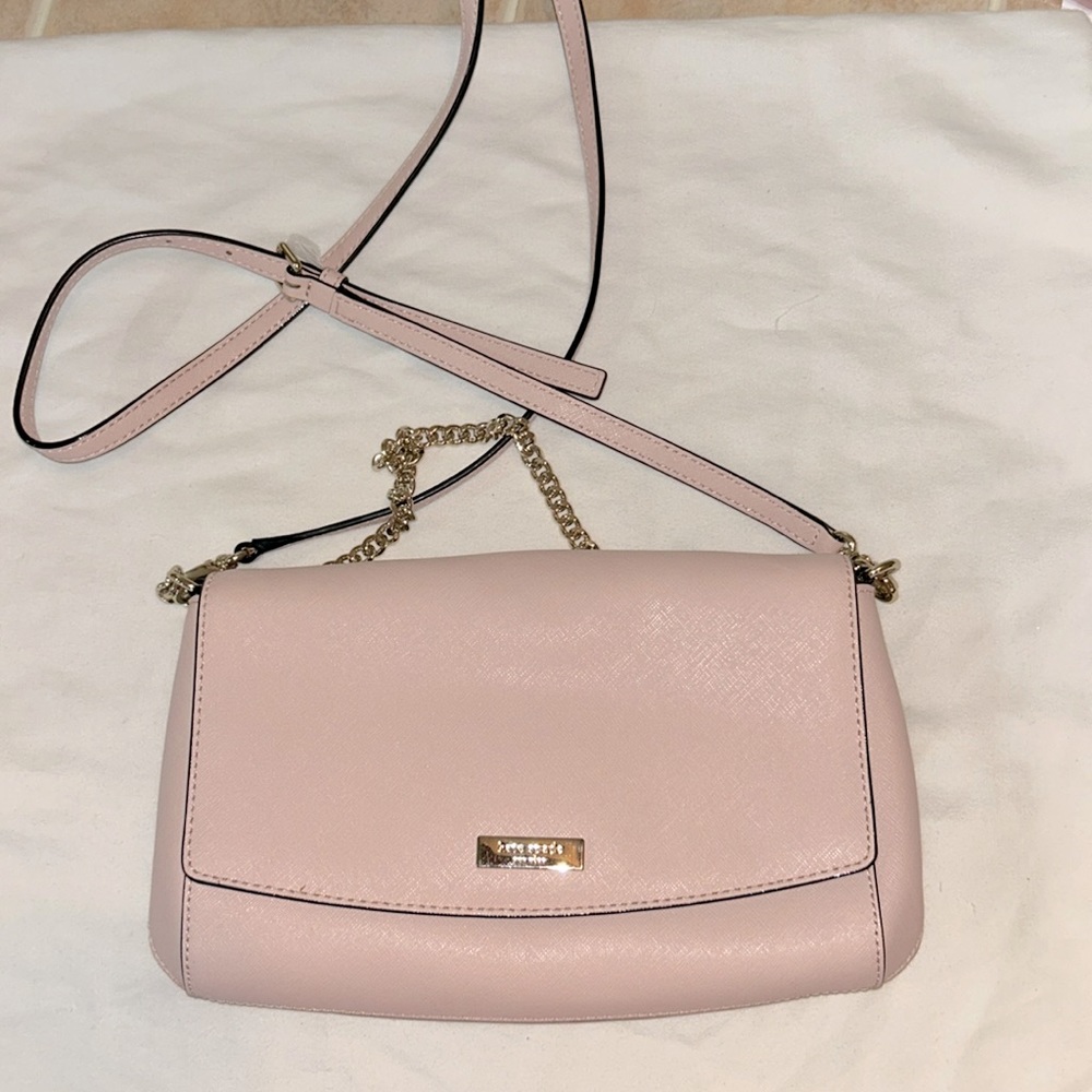Kate Spade pink pocket book.   Brand new. Never used.